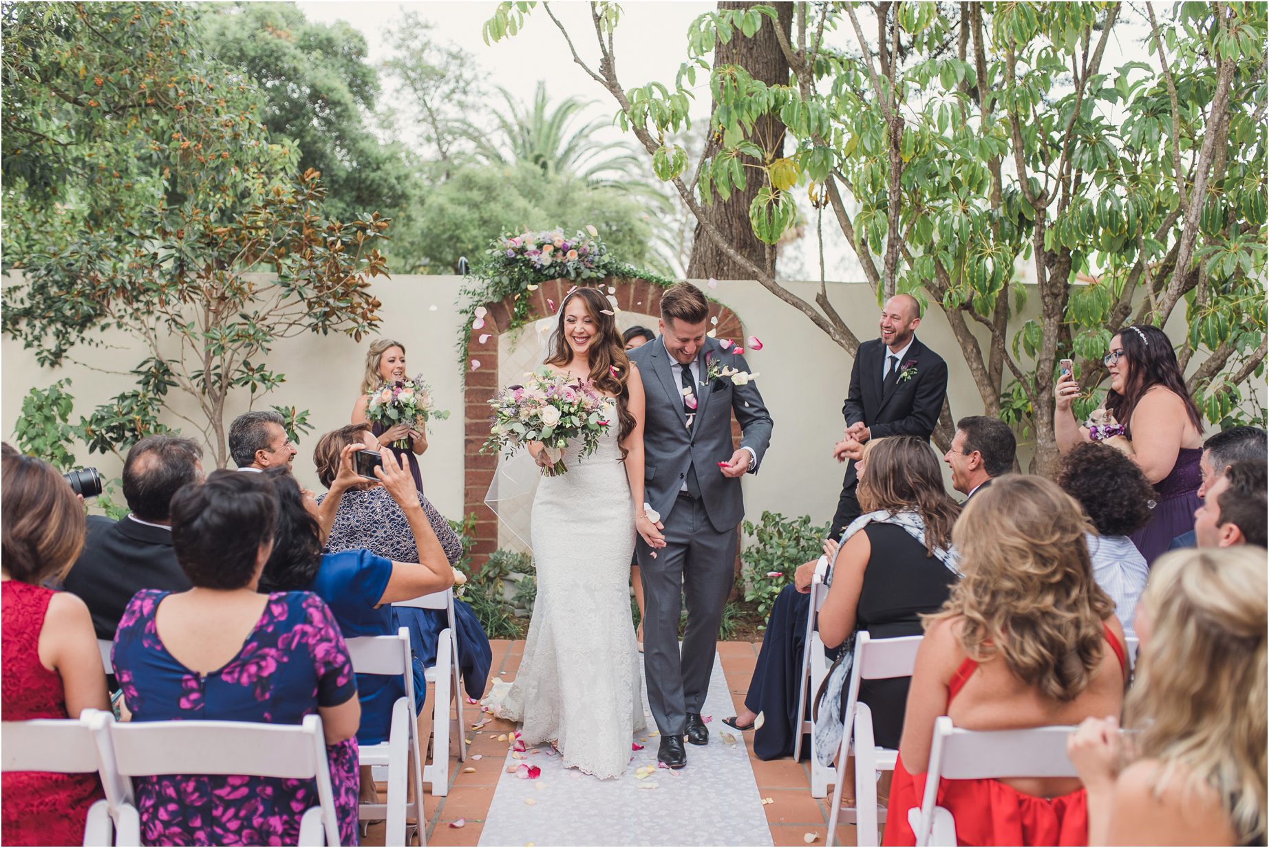 A bride and groom walk down the aisle at the belmond el encanto in Santa Barbara