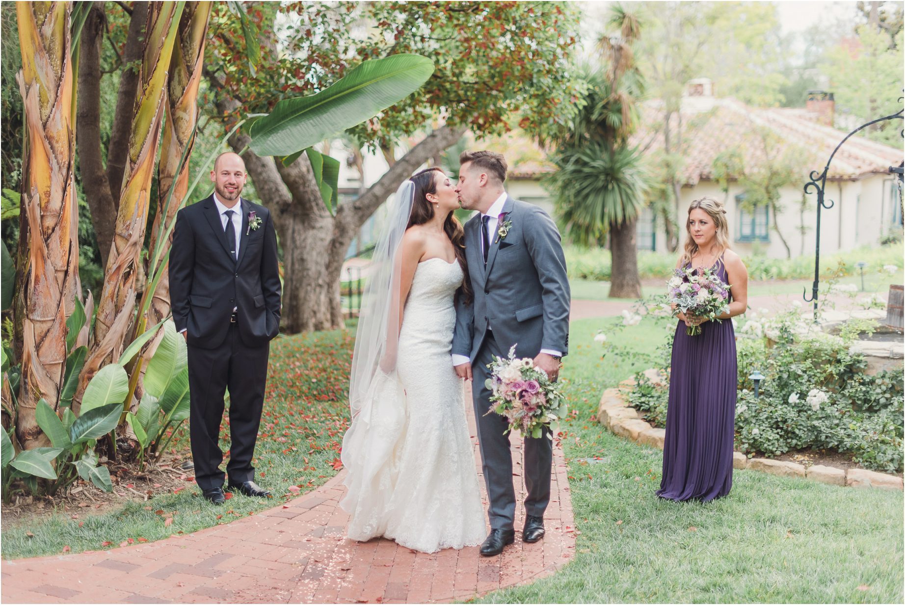 A bride and groom kiss during their couples portraits in santa barbara