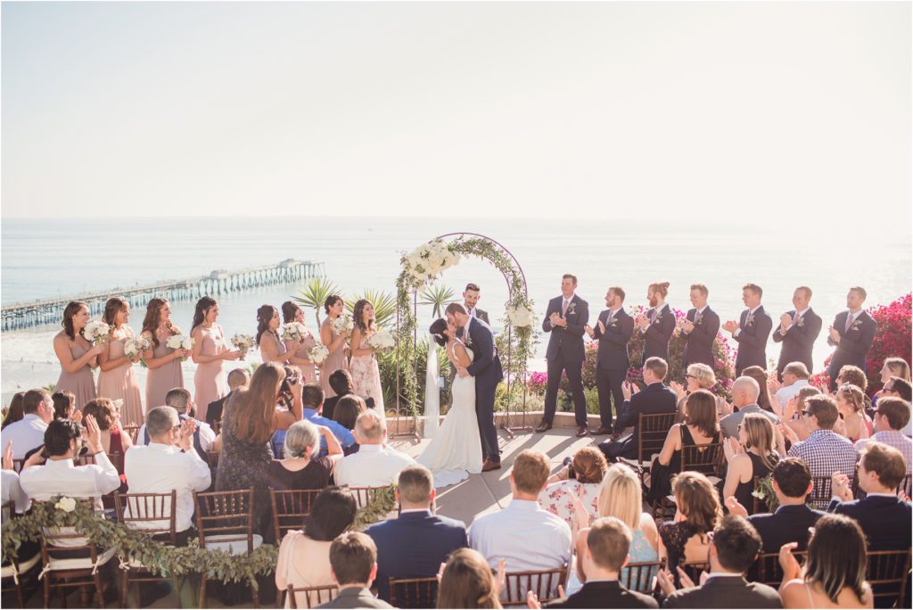 A wedding ceremony at Casa Romantica, overlooking the Pacific Ocean and the San Clemente Pier