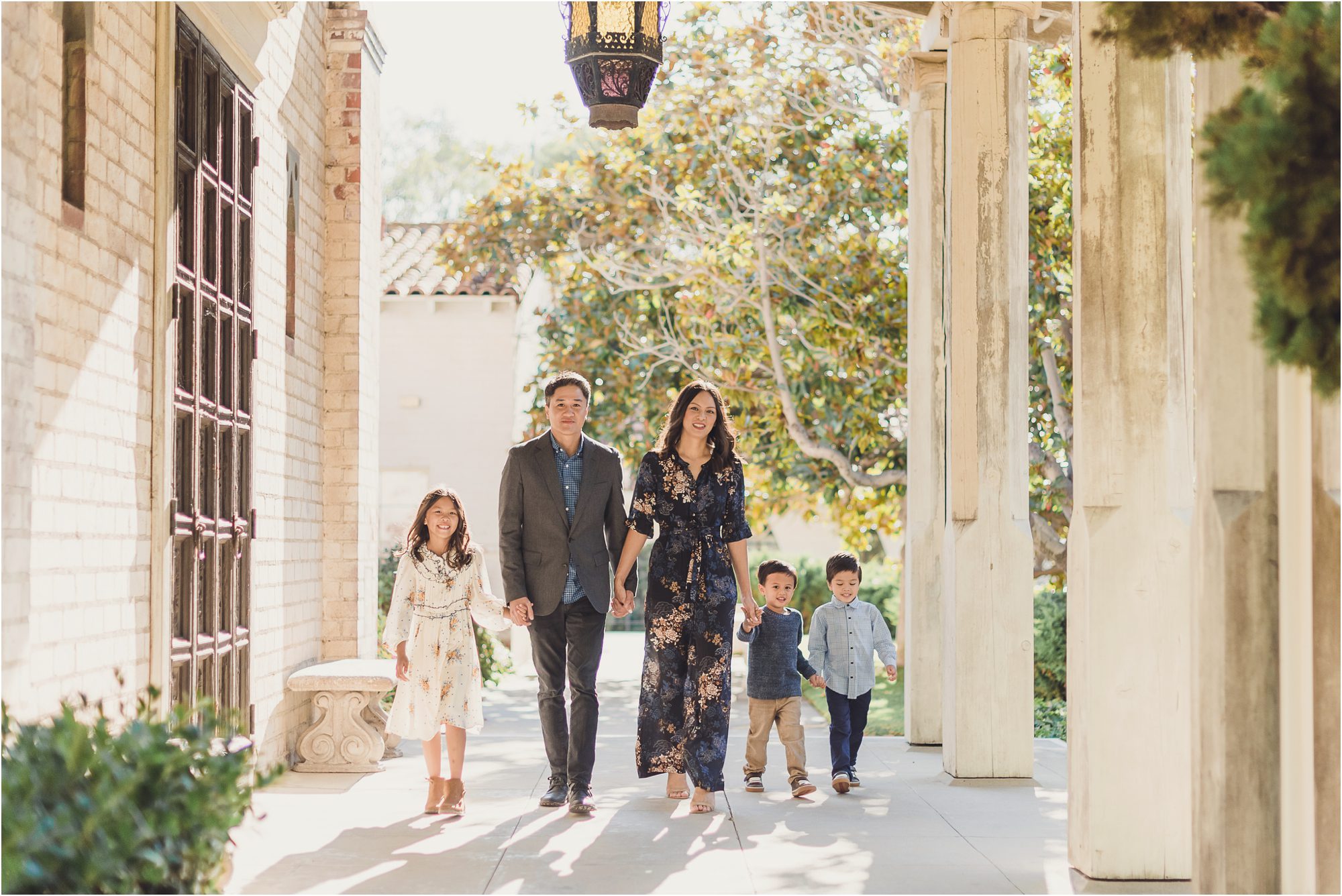 A family walks through a veranda at St Francis Episcopal in PV