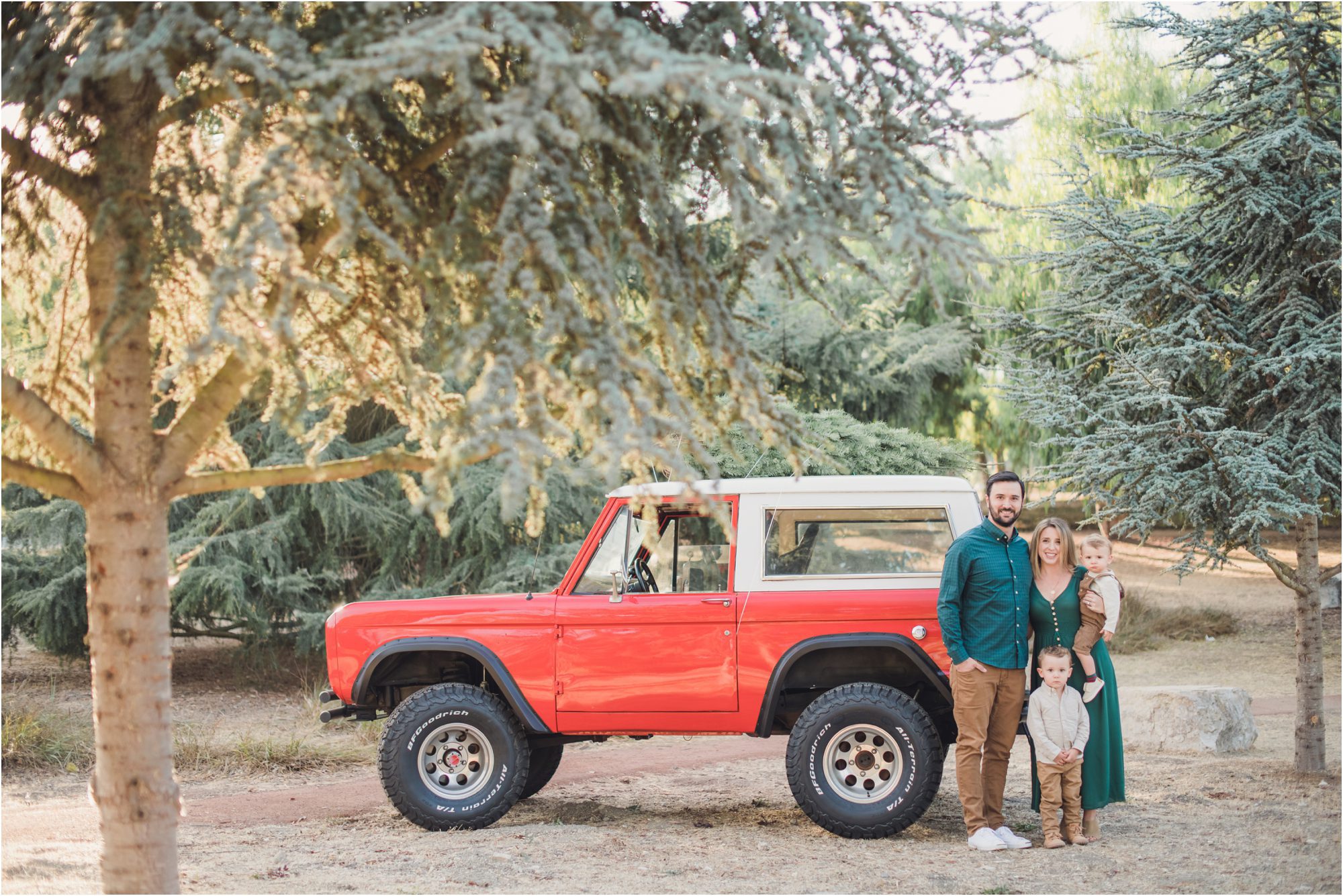The Gibbs Family poses by their car in these So Cal Christmas Family Pictures