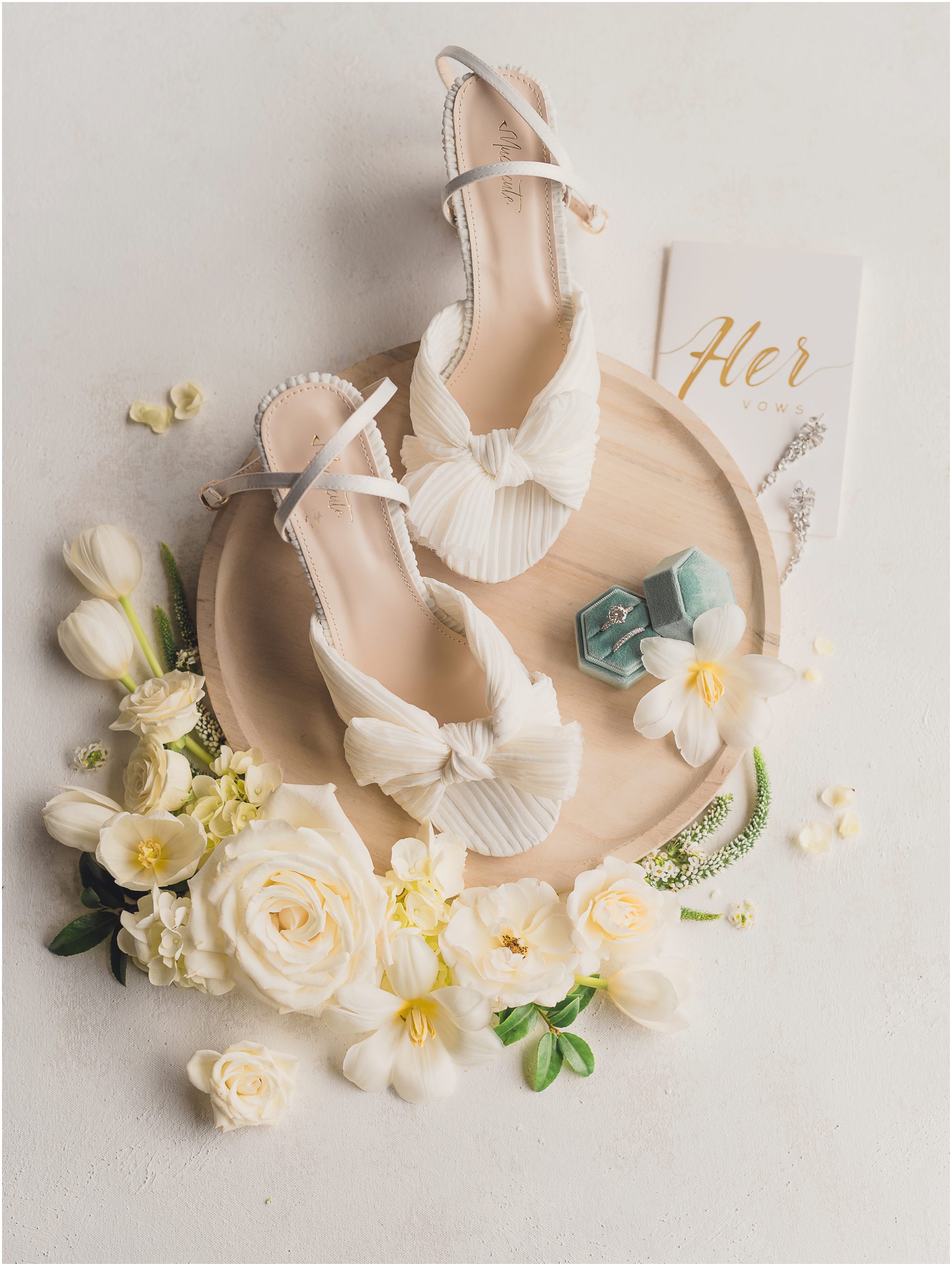A beautiful flat lay made of bridal details from a wedding at All Maria Beach Resort in Encinitas