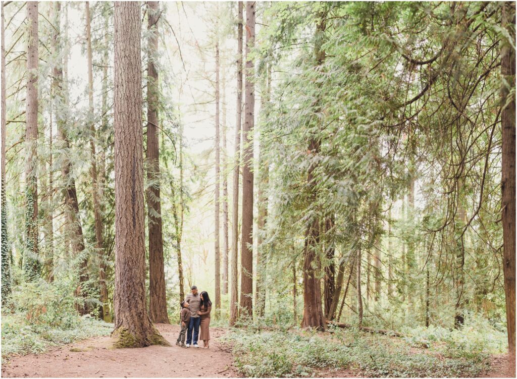 A Family stands in a dense forest during their Tigard Family Photo shoot