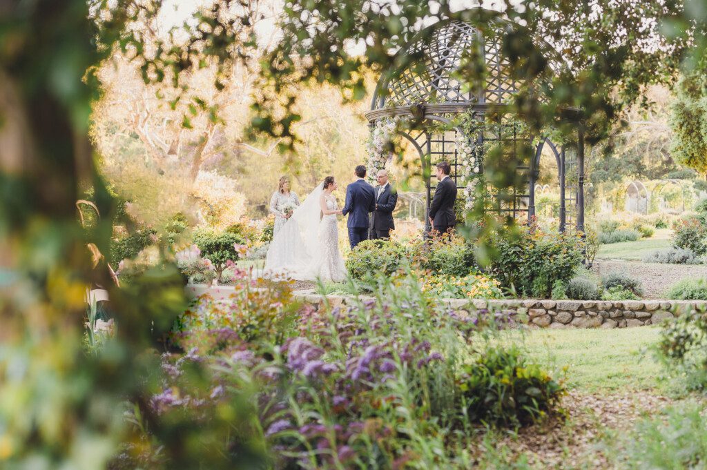 A bride and groom getting married at Descanso Gardens, featured as one of our fairytale Southern California Wedding Venues