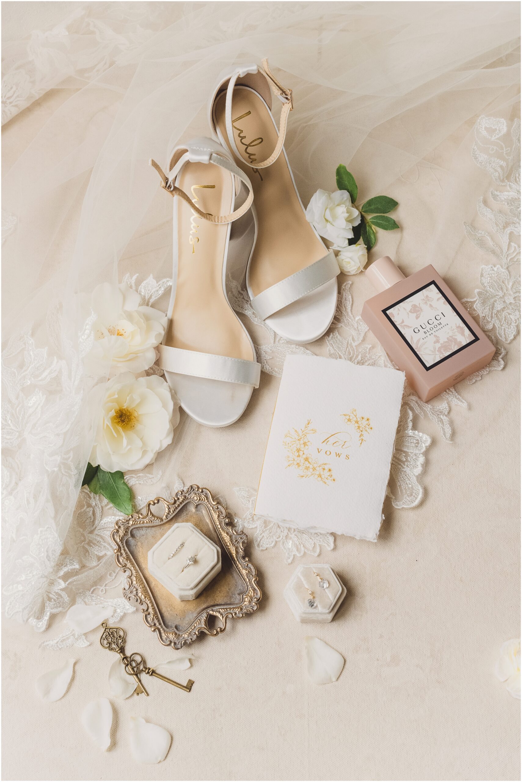 a flatlay featuring white and rose details from a Serendipity Garden Weddings wedding day