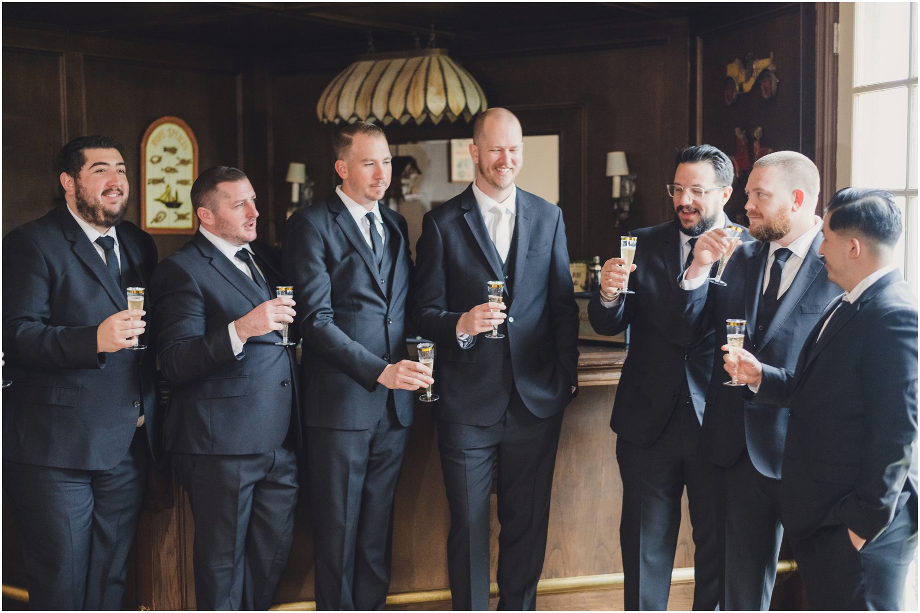 Groom and groomsmen spend a moment together before the wedding