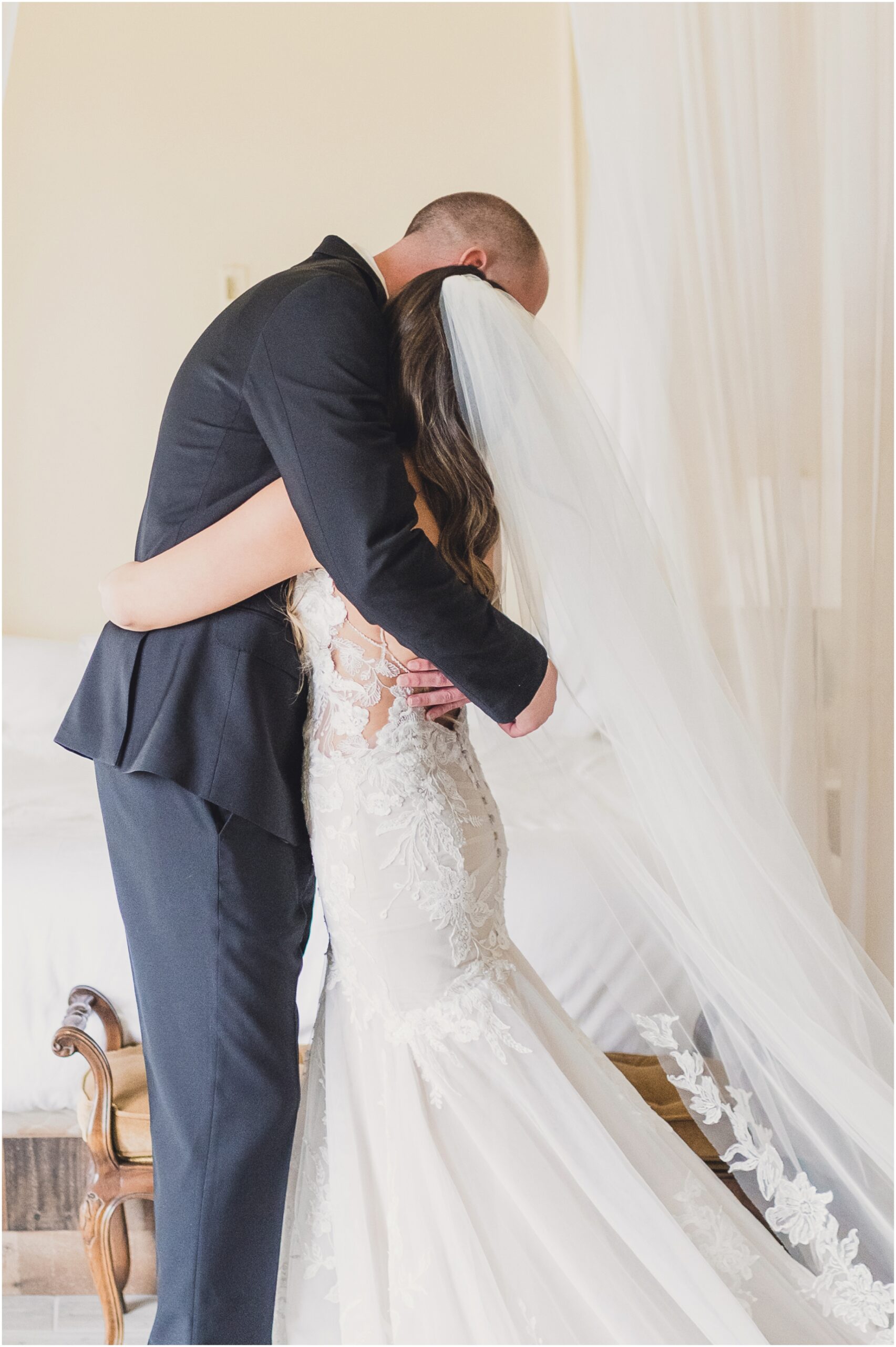 A bride and groom hug during their first look in Southern California