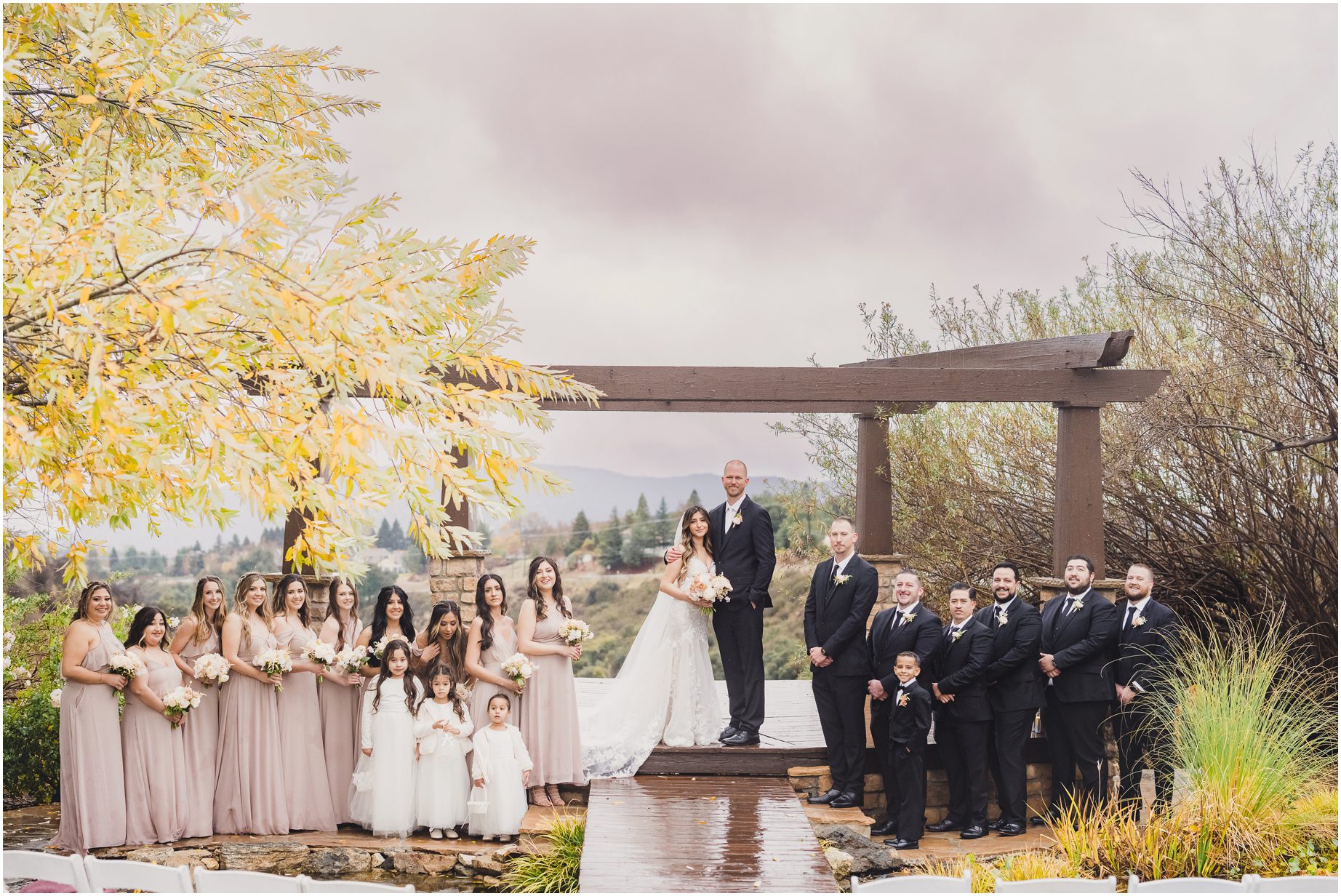 A full bridal party at Serendipity Garden Weddings, on a rainy wedding day