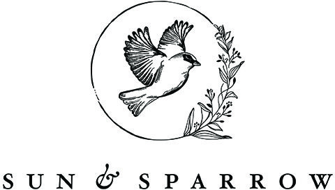 Sun and Sparrow Logo with sparrow and assorted leaves and flowers