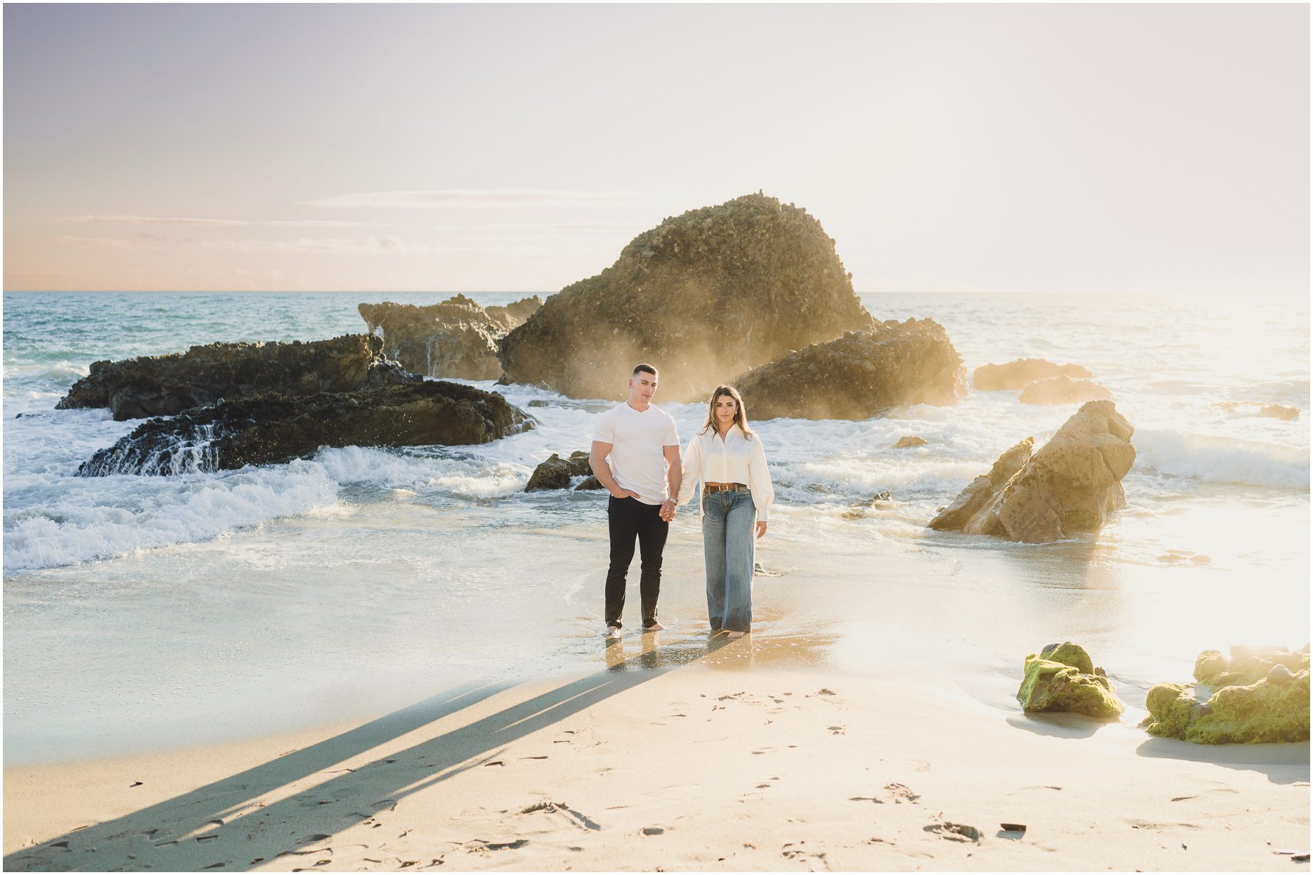 Kendal & Bruce pose at woods cove in Laguna Beach, in front of rocky outcroppings during their Laguna Beach engagement session