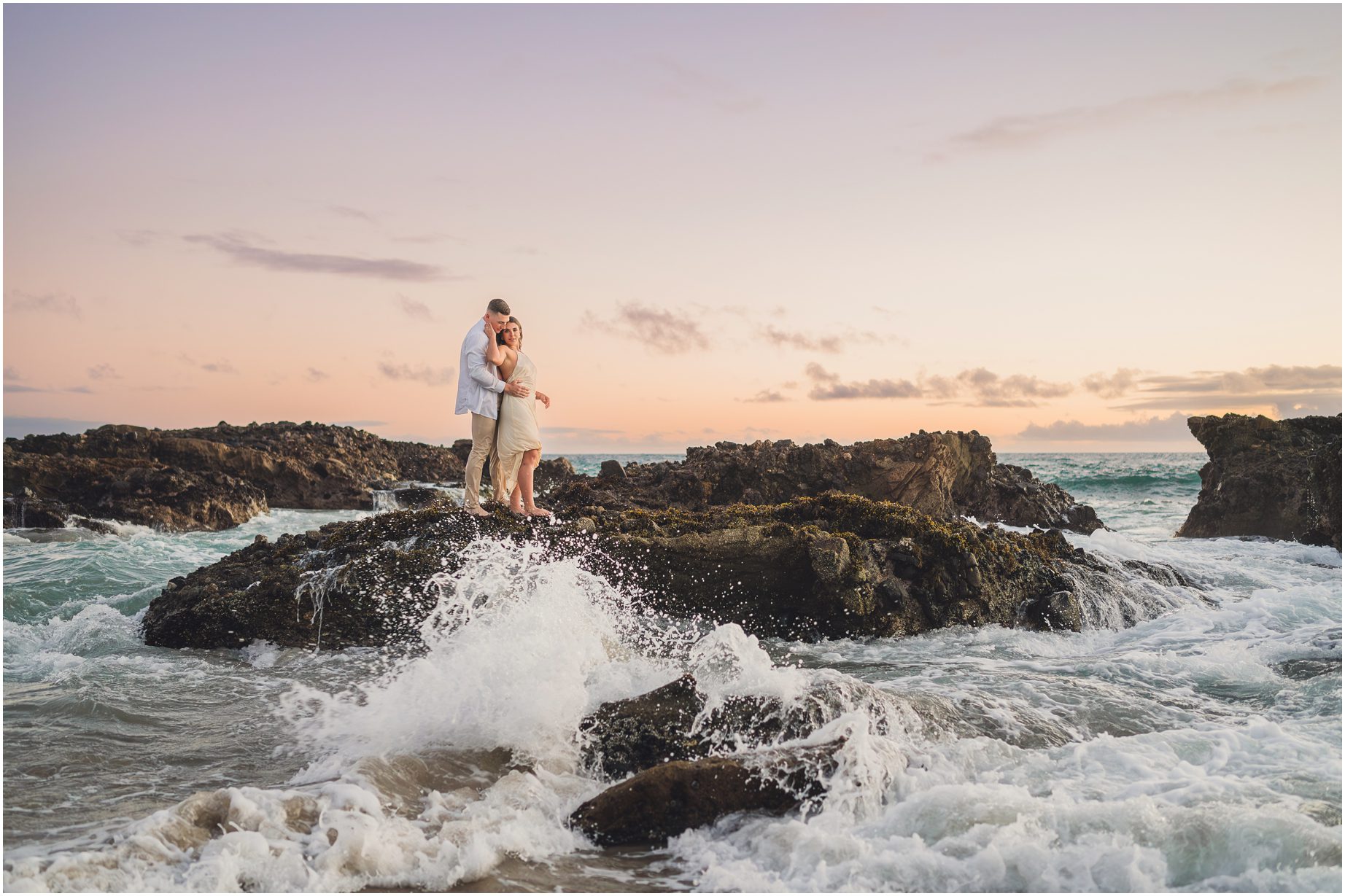 Kendall & Bruce Pose on the rocks for their woods cove engagement session in Laguna Beach