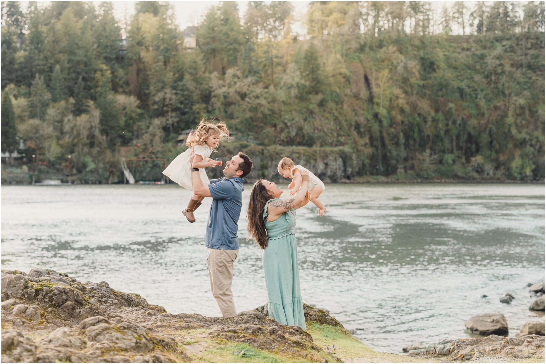 A Mother and Father lift their children up during their Whimsical Lake Oswego Family Photo Session