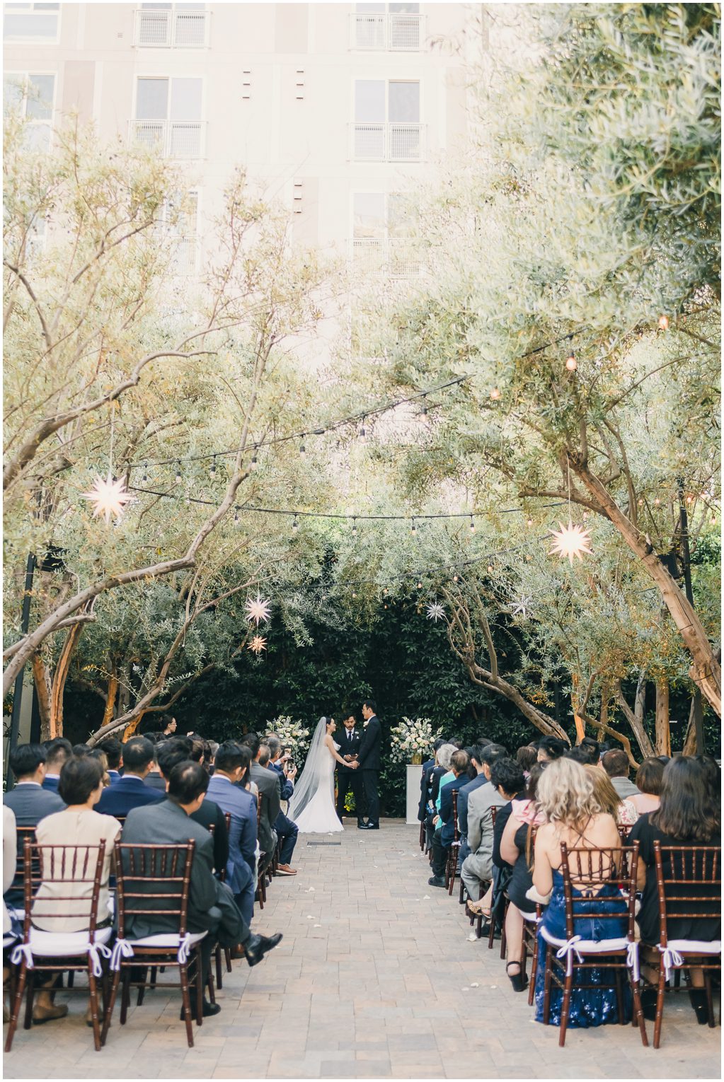 Redbird LA Wedding Photographer ceremony with Olive trees