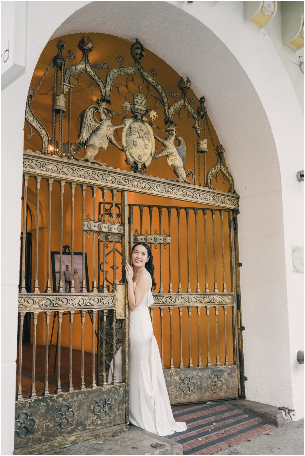 Bride at an arch at the Redbird LA