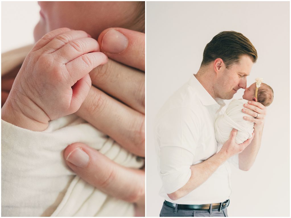 Newborn's hand on mom's fingers, Dad holds newborn