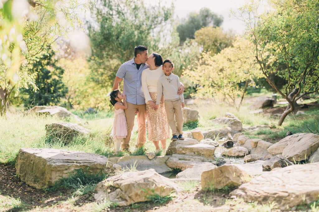 Peaceful Mini Sessions at Hopkins Wilderness Park 1 A family stands to take mini sessions at Hopkins Wilderness Park, in Torrance